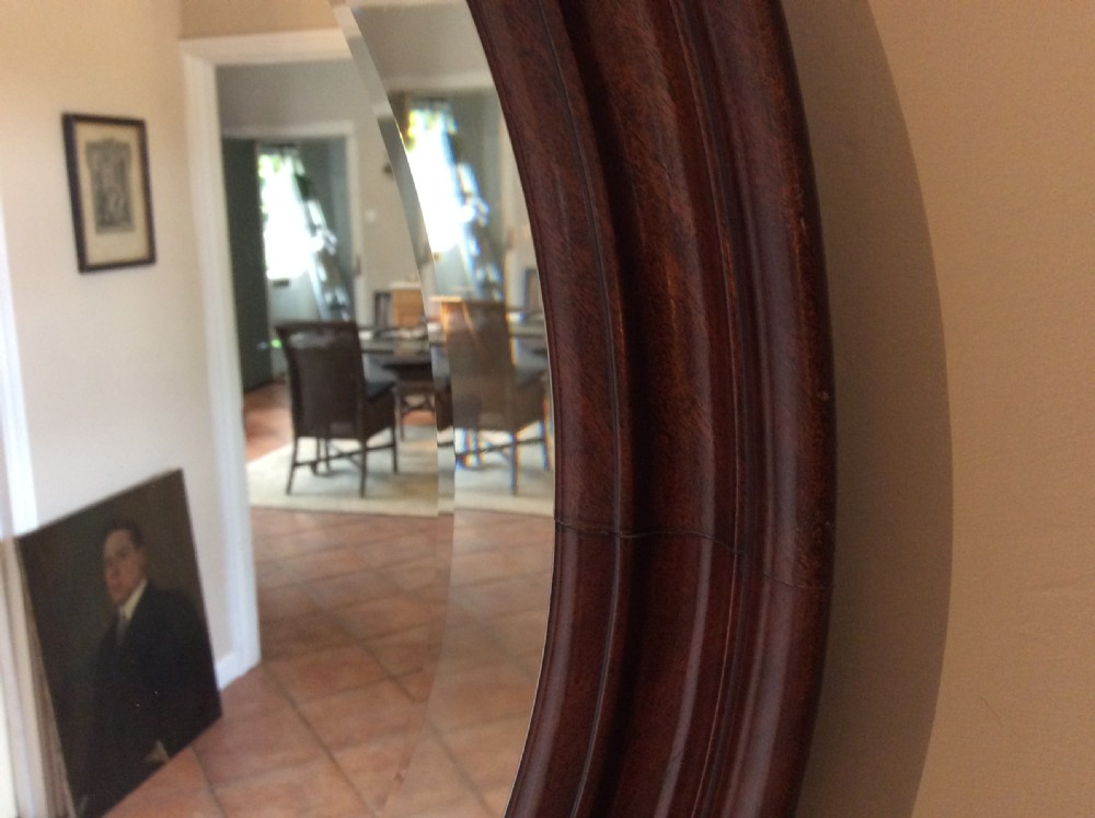 An Edwardian deep framed circular mirror View V