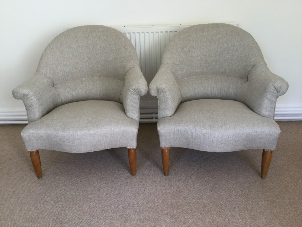A pair of French upholstered armchairs View II