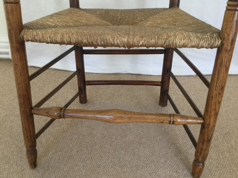 An 18thC rush seat spindle back chair View V