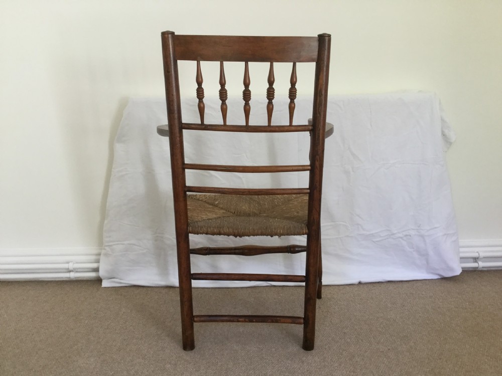 An 18thC rush seat spindle back chair View VI