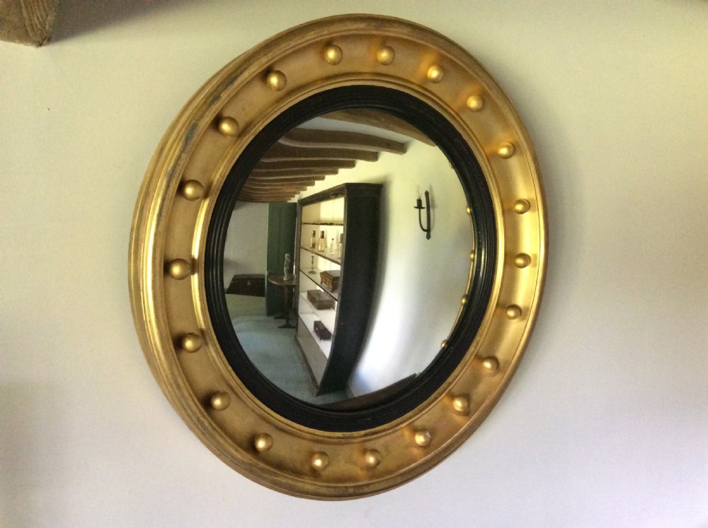 19thC 59cm round convex wall mirror View II