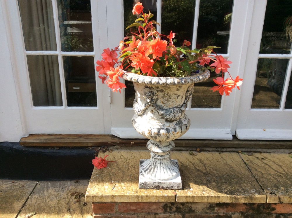 A pair of cast iron garden urns View II