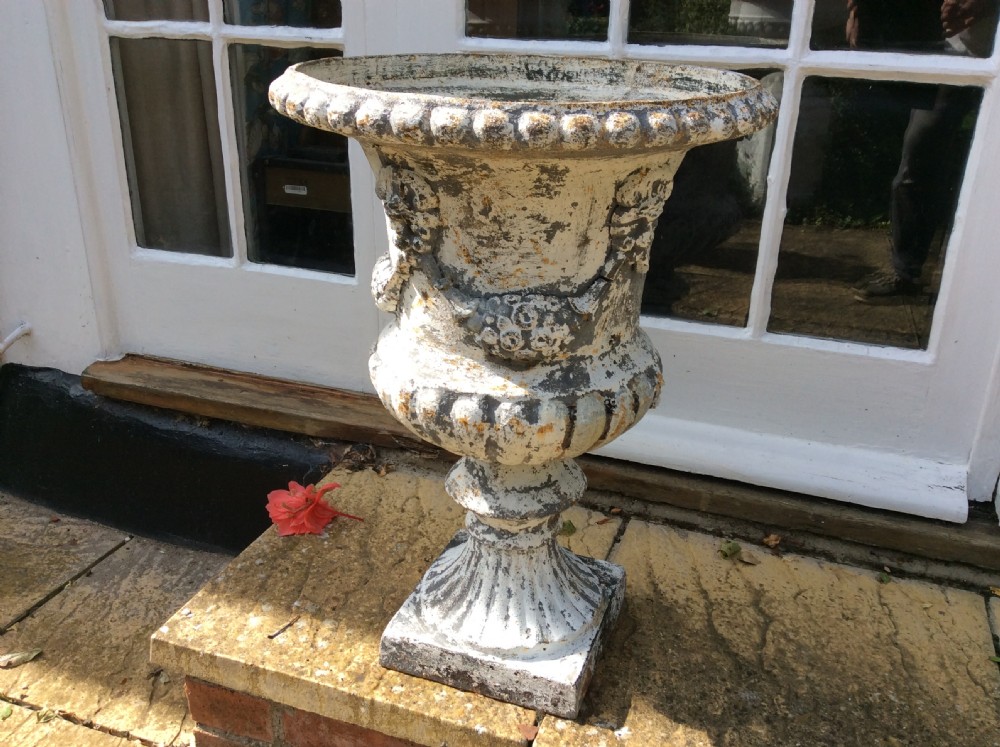 A pair of cast iron garden urns View III