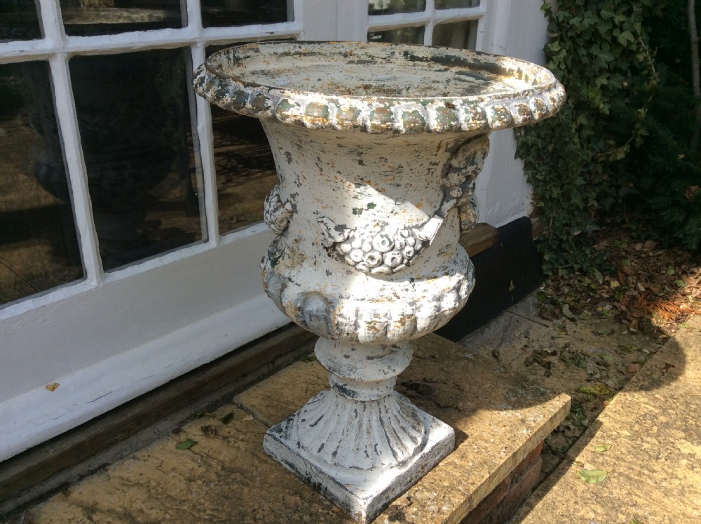 A pair of cast iron garden urns View IV