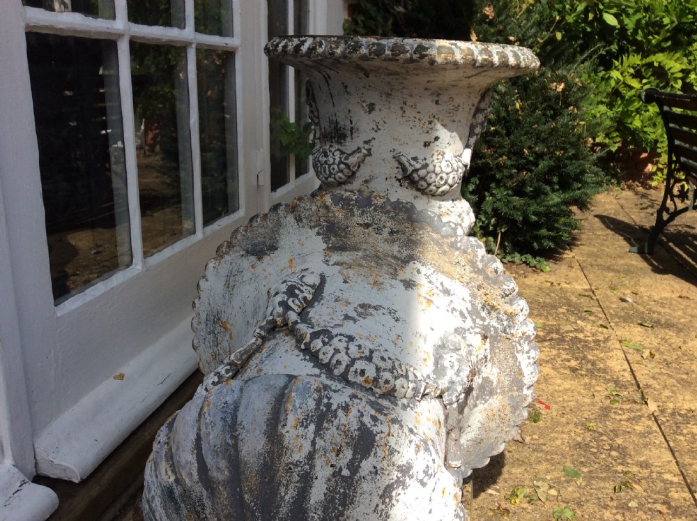 A pair of cast iron garden urns View XI
