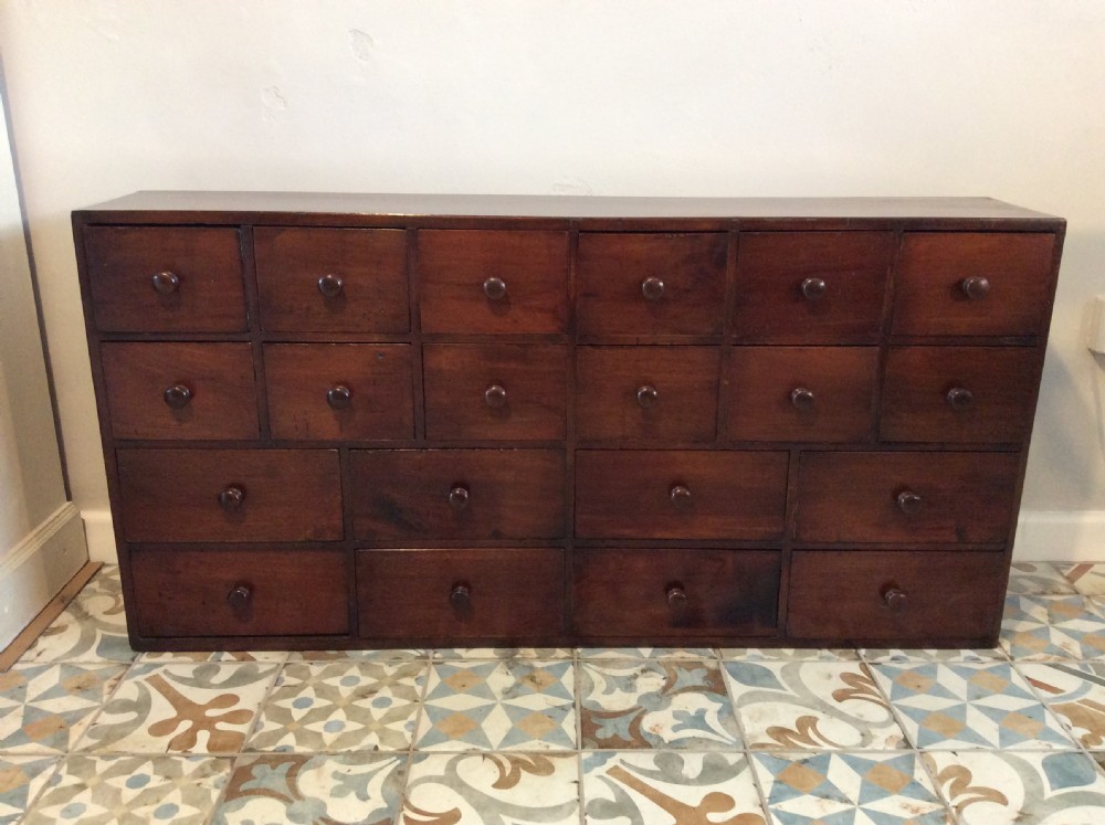 A 122 cm wide bank of drawers