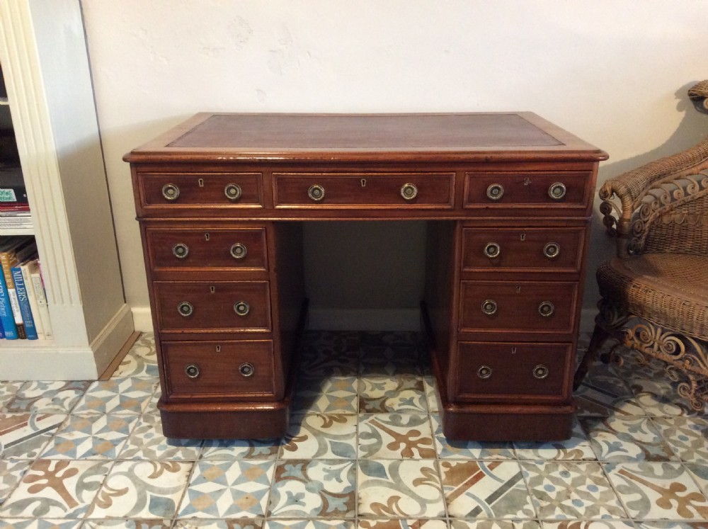 A 19thC 9 drawer pedestal desk