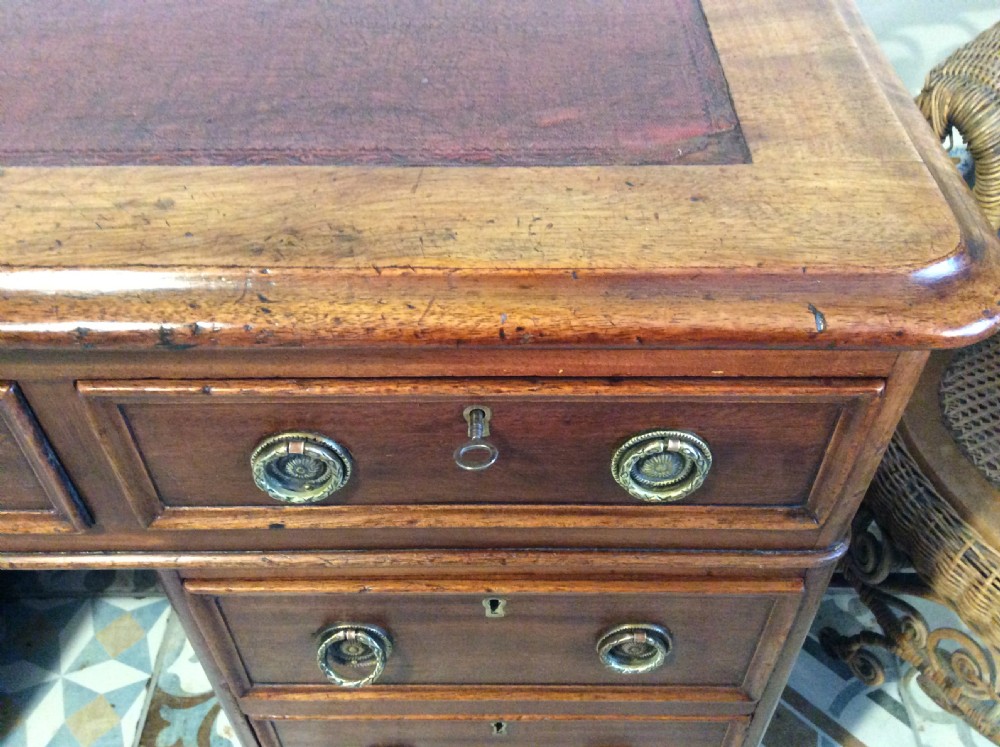 A 19thC 9 drawer pedestal desk View VII