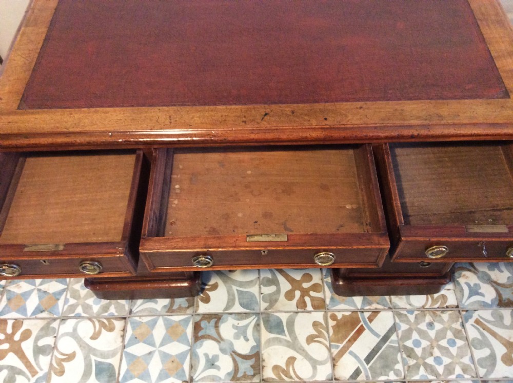 A 19thC 9 drawer pedestal desk View VIII