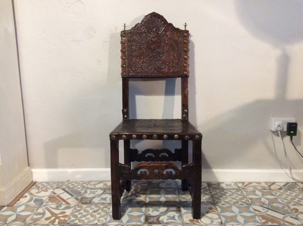 A 17thC Spanish walnut hall chair