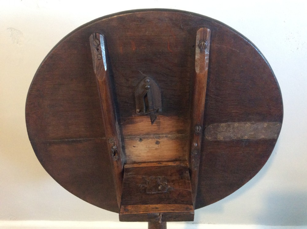 An 18thC oak & elm tripod wine table View V