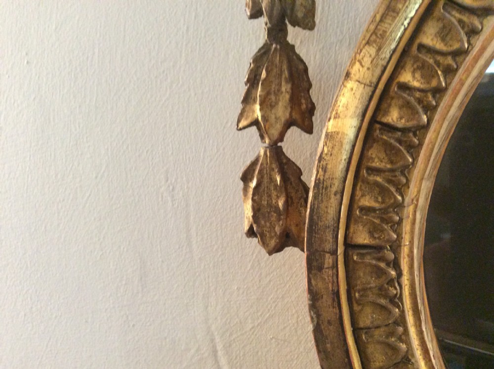 A small  gilded19thC Adams style mirror View VI