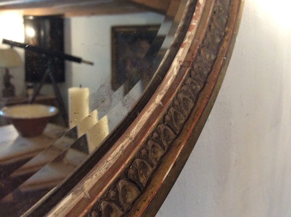 A small  gilded19thC Adams style mirror View VII