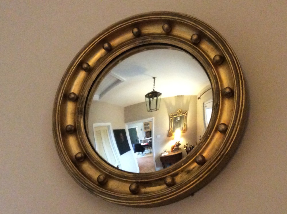 An early 19thC convex wall mirror