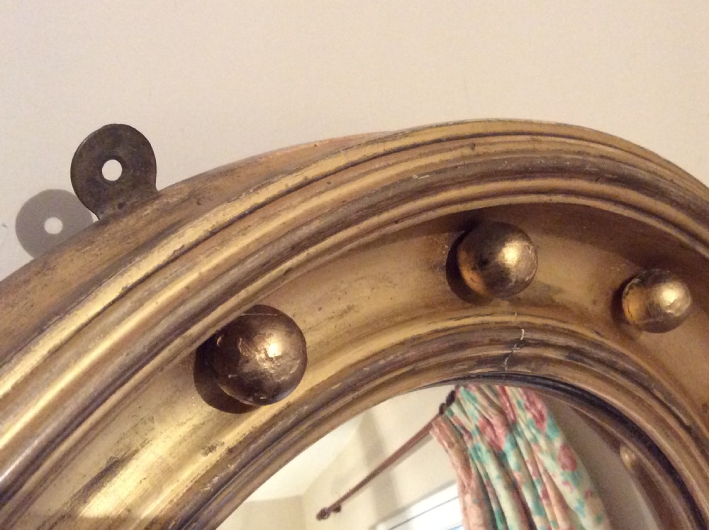 An early 19thC convex wall mirror View II