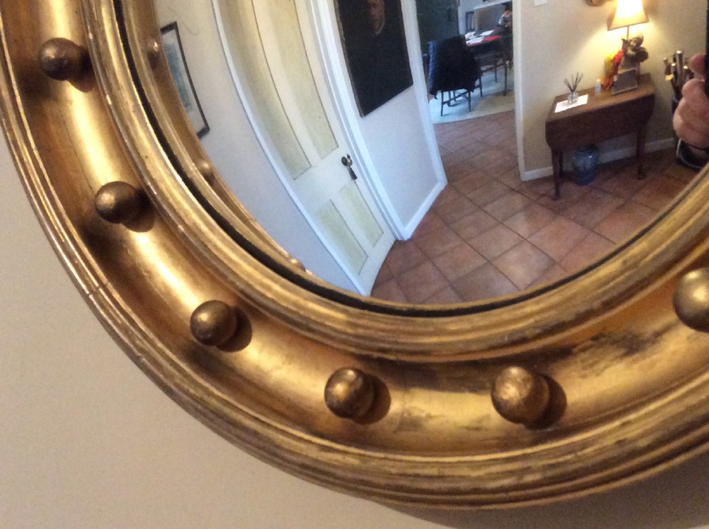 An early 19thC convex wall mirror View IV