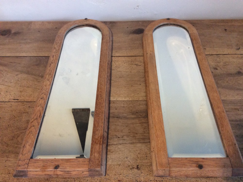 A pair of bleached oak framed pier mirrors View II