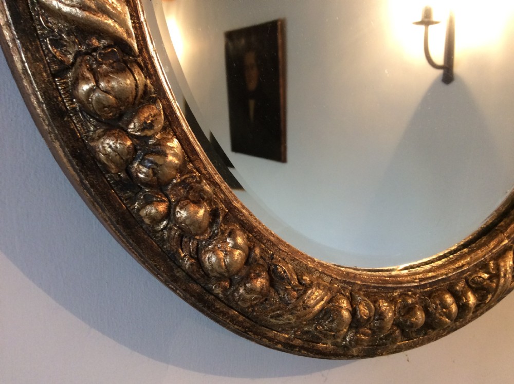 A gilded circular mirror View II