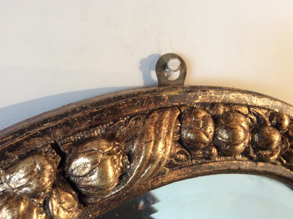 A gilded circular mirror View III