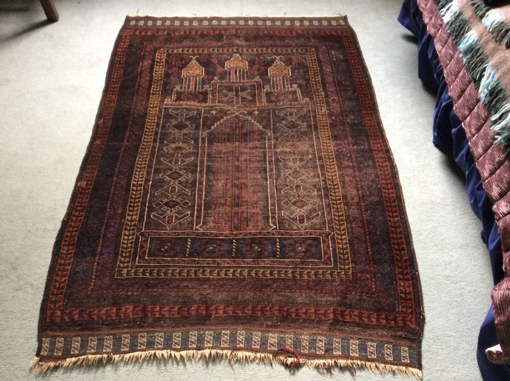 A small antique Caucasian hall rug