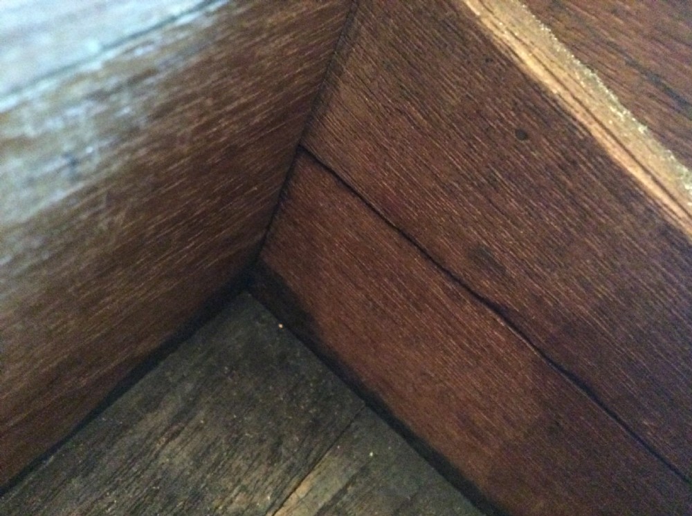 A rectangular warm brown teak campaign writing box featuring flush brass strapwork on the corners and a central decorative brass keyhole escutcheon. View XII