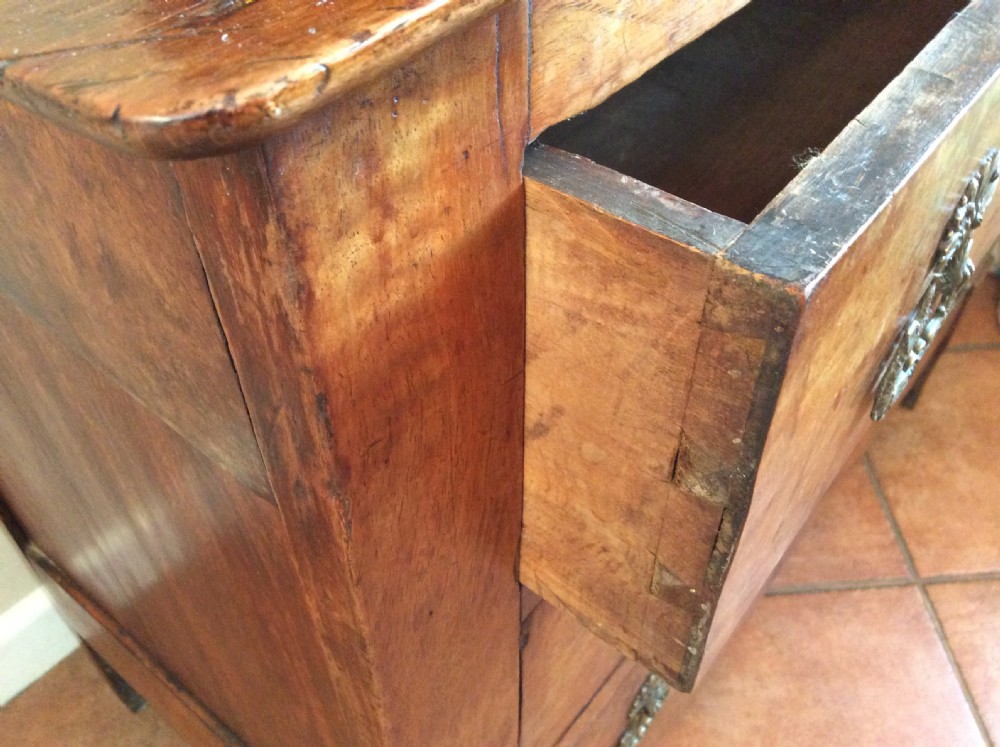 A small walnut chest of drawers View V