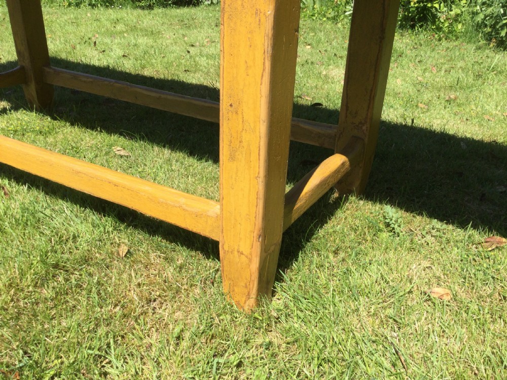 A rectangular warm pine farmhouse kitchen table featuring two end extension leaves supported by a sturdy square-legged stretcher base. View VIII