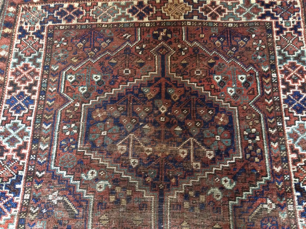 An antique 173cm x 122 Caucasian rug View II