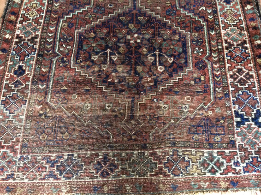 An antique 173cm x 122 Caucasian rug View III