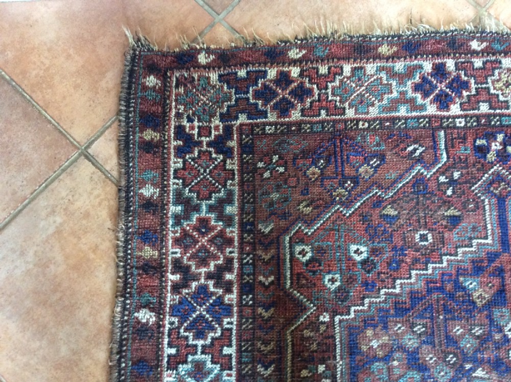 An antique 173cm x 122 Caucasian rug View V