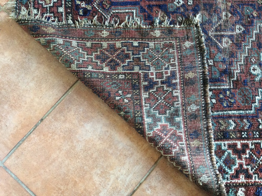 An antique 173cm x 122 Caucasian rug View VIII