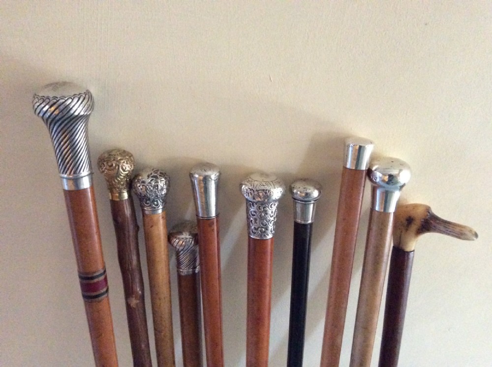 A collection of 10 walking sticks and canes View XI