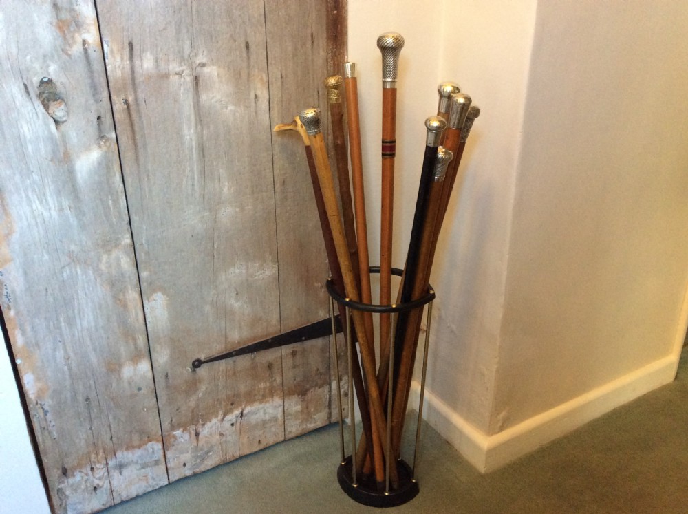 A collection of 10 walking sticks and canes View XIV