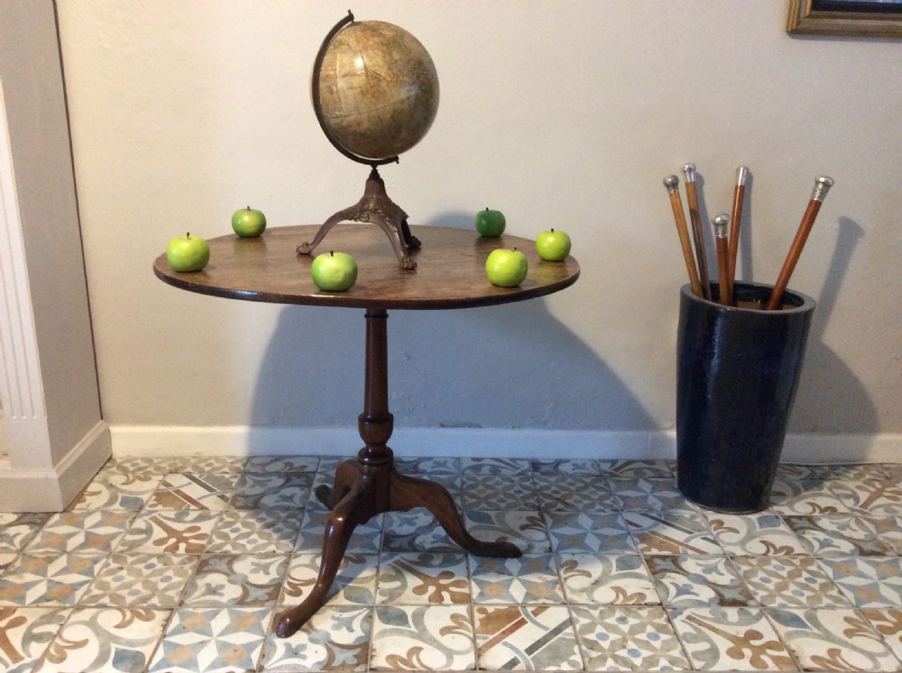 A Georgian oak and elm tilt top tripod table View II