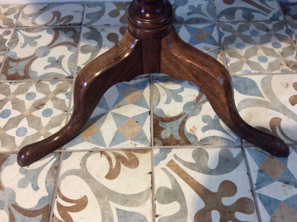 A Georgian oak and elm tilt top tripod table View X