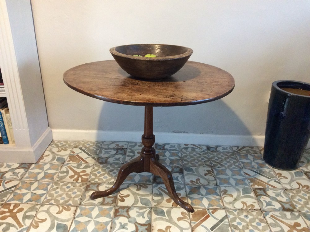 A Georgian oak and elm tilt top tripod table View XIV