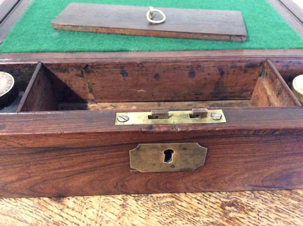 A closed 19th-century dark mahogany campaign writing slope with flush brass side handles and a brass escutcheon with key. View VIII