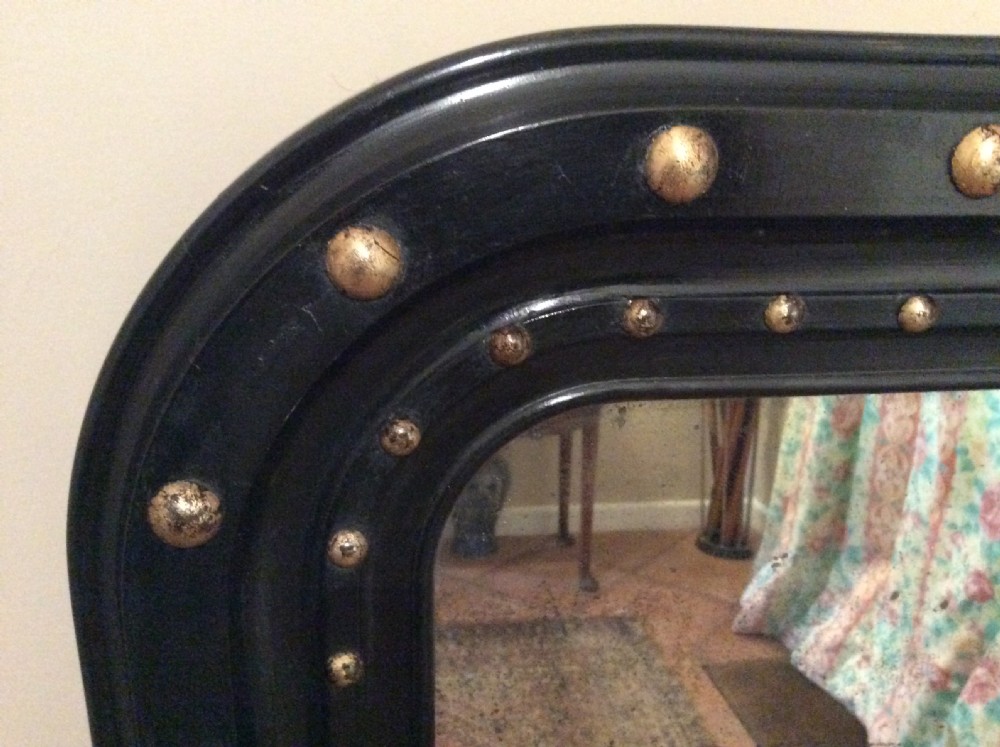 An ebonised French overmantle mirror View III