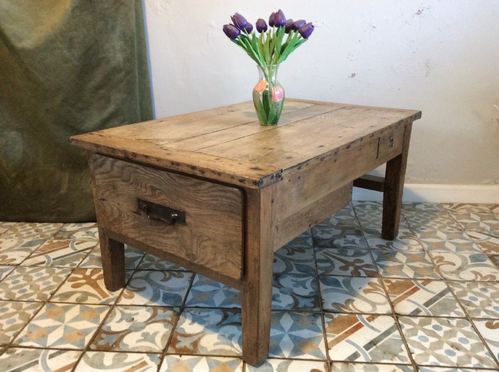 A French elm topped coffee table