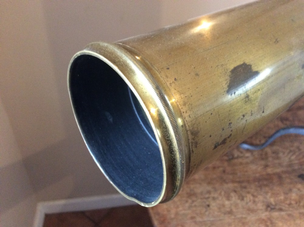 A nineteenth-century brass terrestrial library telescope supported by a dark tripod stand. View XIII