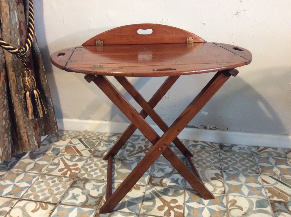 A 19thC oval butlers tray on stand