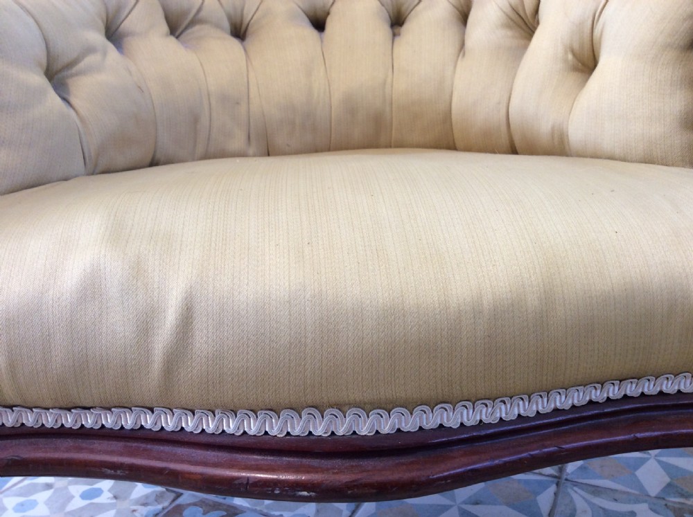 A near pair of Victorian button-backed tub armchairs upholstered in yellow fabric with carved mahogany cabriole legs on castors. View XIV