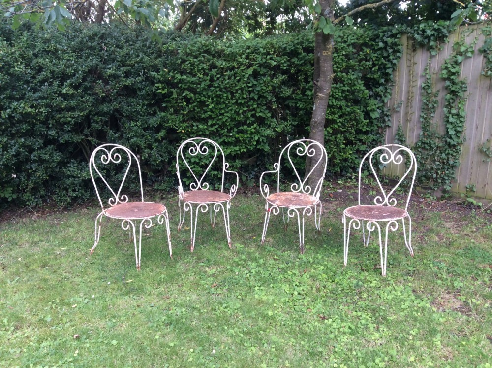 A table together with set of French iron garden chairs  View II