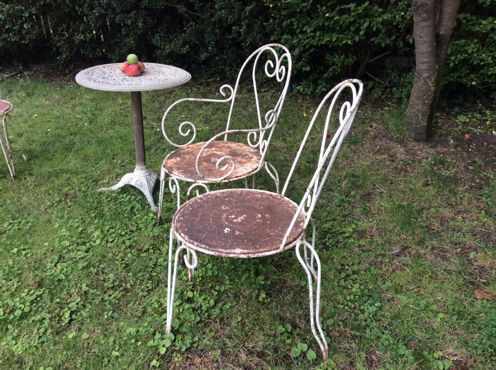 A table together with set of French iron garden chairs  View V