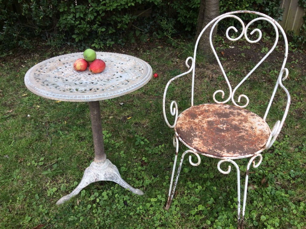 A table together with set of French iron garden chairs  View IX