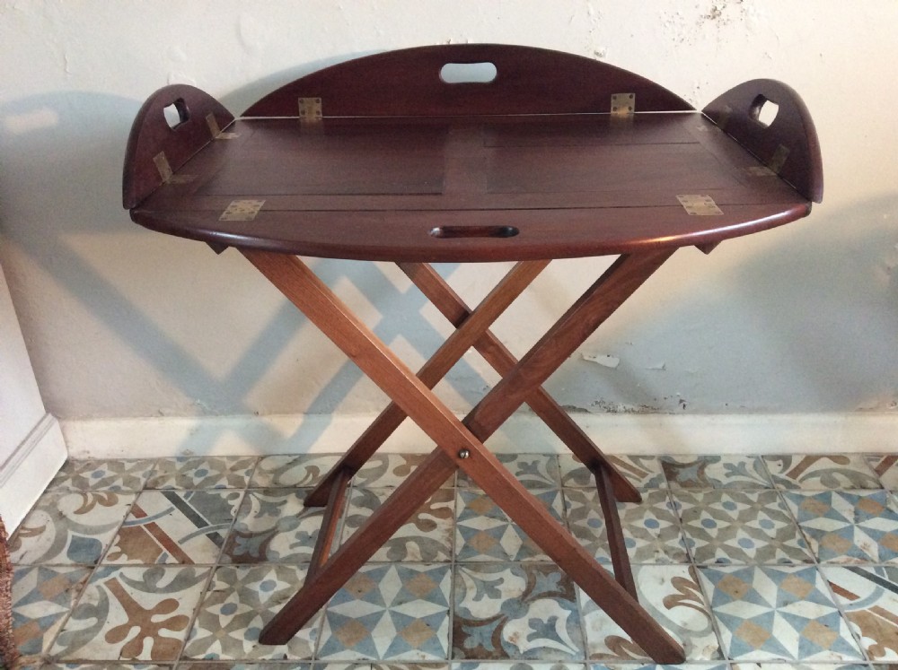 A late Georgian oval butlers tray on stand