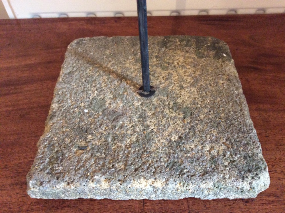An early 20th-century copper weather vane featuring running figures with a natural verdigris patina, mounted on a stone block stand. View XV