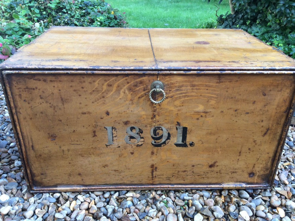 A pair of rectangular Victorian deed boxes finished in warm ochre paint with dark metal edging, ring pull handles, and black stencilled dates reading 1891 and 1911. View VII