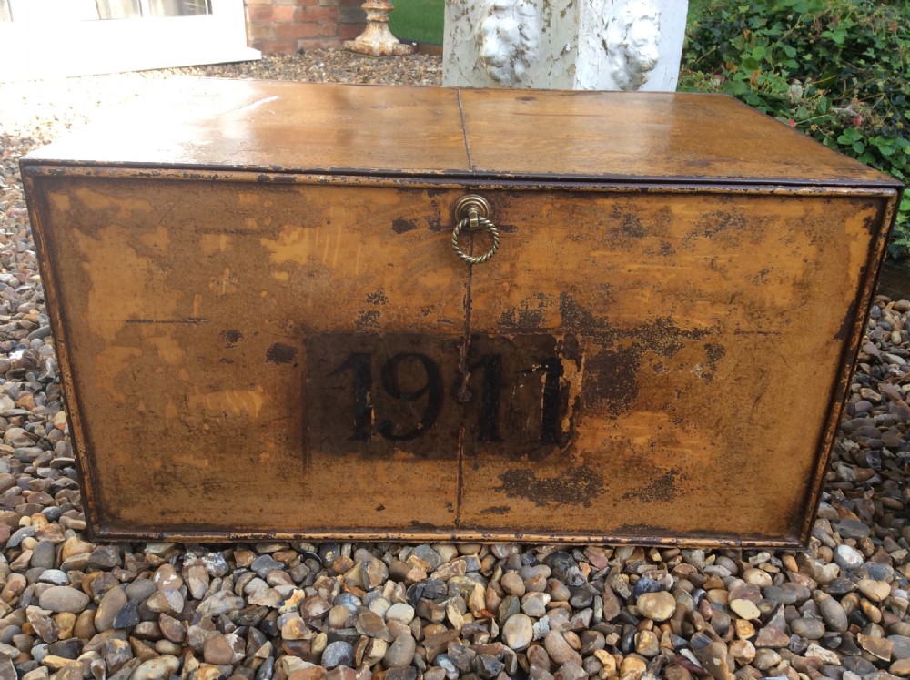 A pair of rectangular Victorian deed boxes finished in warm ochre paint with dark metal edging, ring pull handles, and black stencilled dates reading 1891 and 1911. View VIII