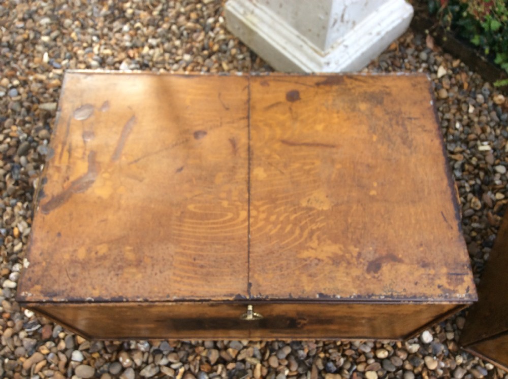 A pair of rectangular Victorian deed boxes finished in warm ochre paint with dark metal edging, ring pull handles, and black stencilled dates reading 1891 and 1911. View XII